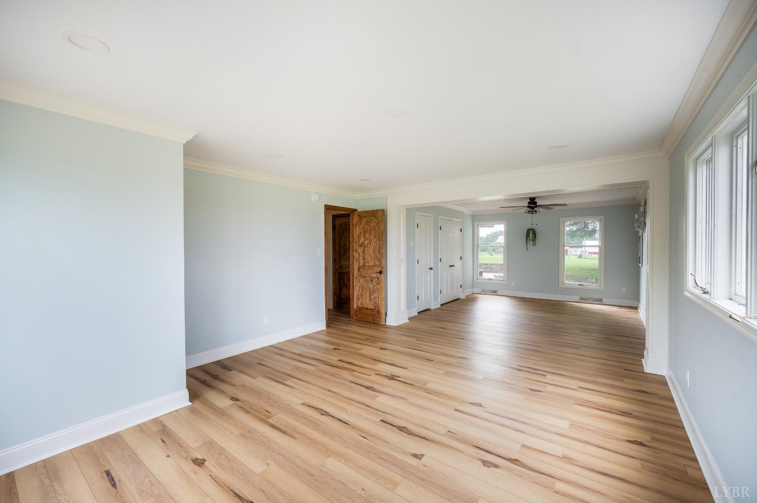 7845 Bear Creek Road Gladys, VA 24554 - Photo 51 of 99 a view of empty room with wooden floor and fan