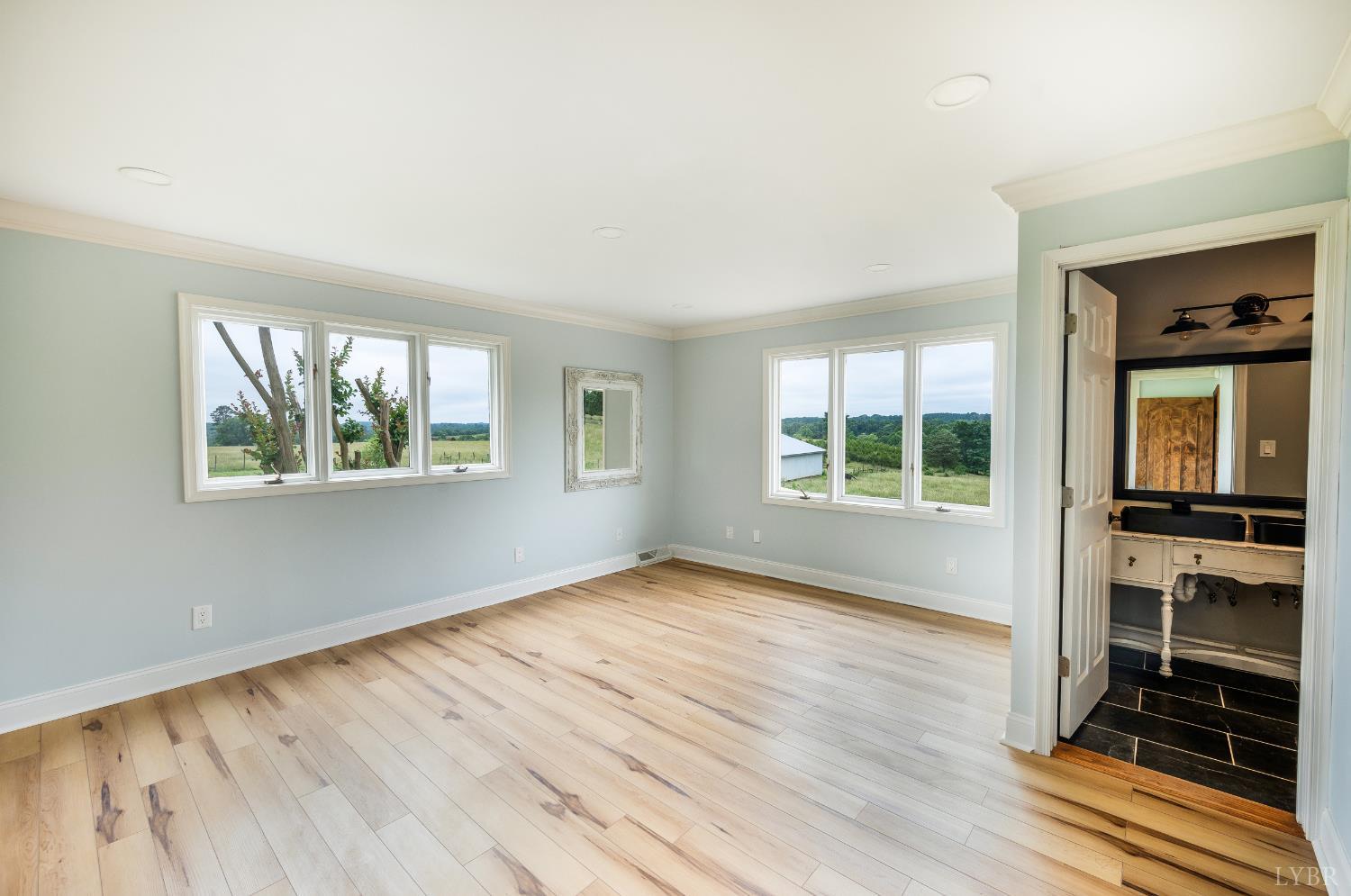7845 Bear Creek Road Gladys, VA 24554 - Photo 52 of 99 an empty room with wooden floor cabinet and windows