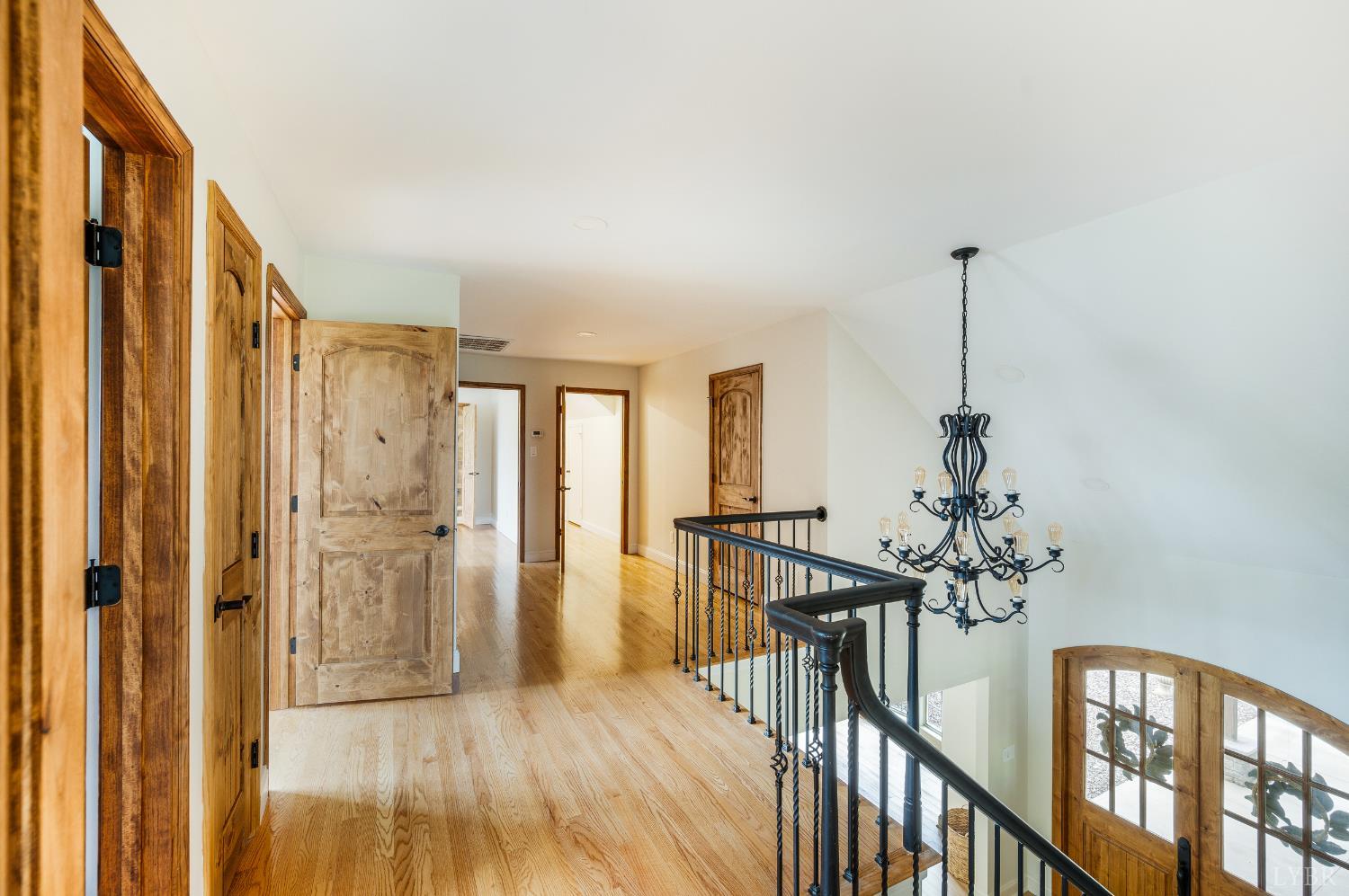 7845 Bear Creek Road Gladys, VA 24554 - Photo 56 of 99 a view of a hallway with wooden floor and stairs