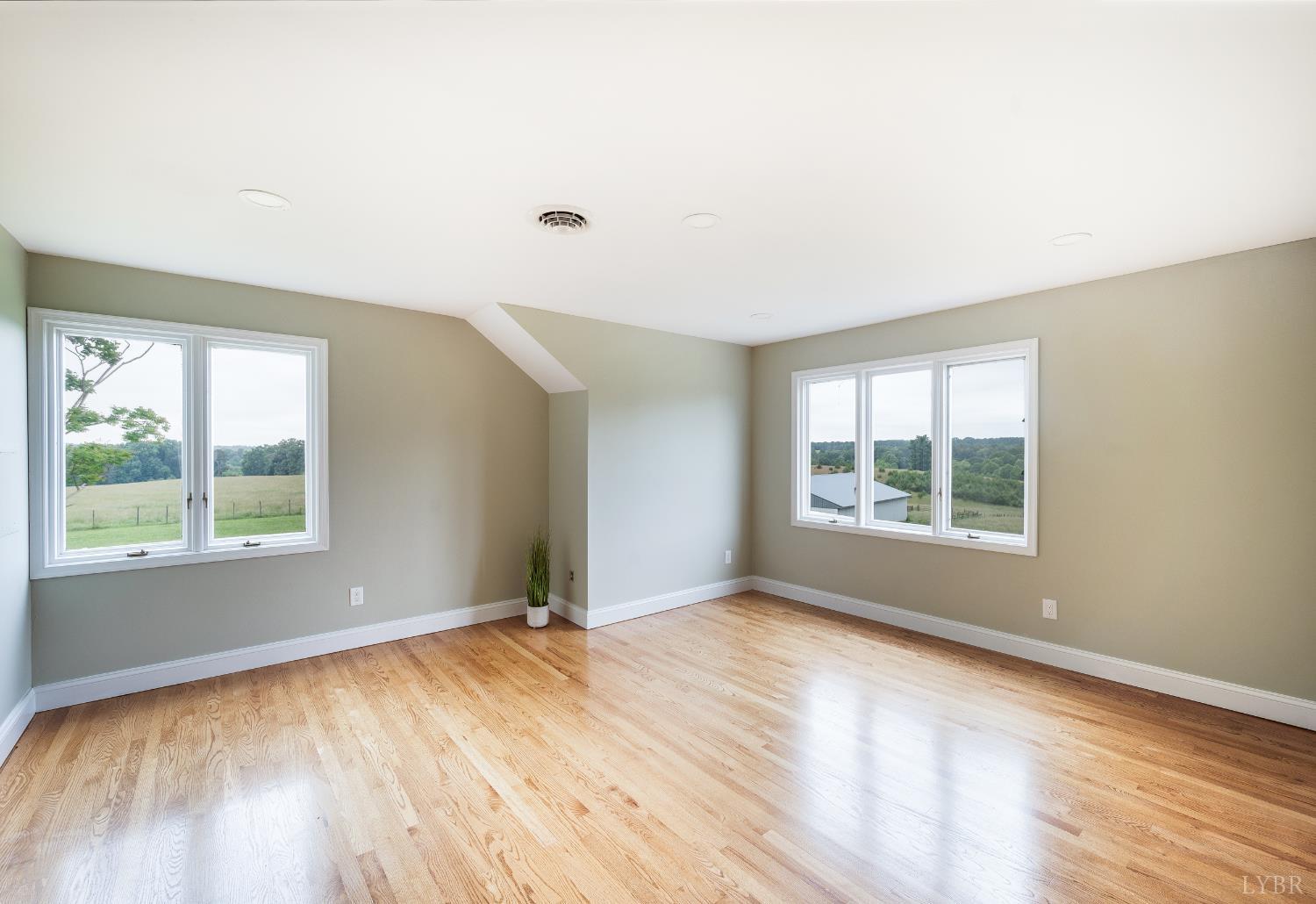 7845 Bear Creek Road Gladys, VA 24554 - Photo 57 of 99 an empty room with wooden floor and windows