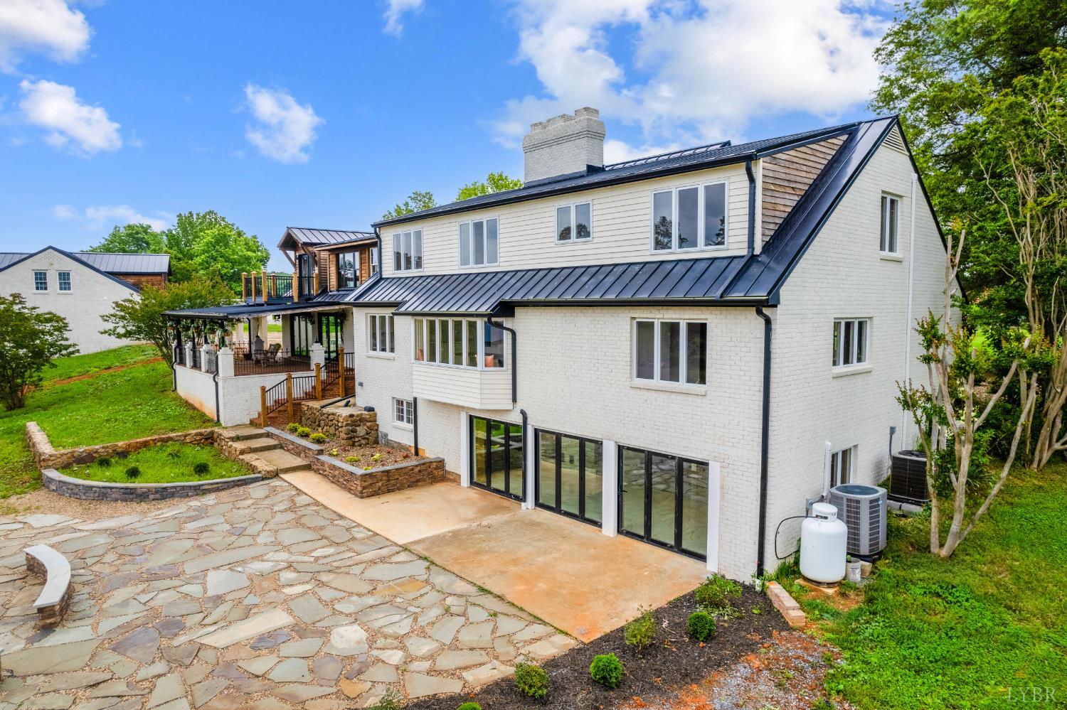 7845 Bear Creek Road Gladys, VA 24554 - Photo 7 of 99 a front view of a house with a yard outdoor seating and barbeque oven