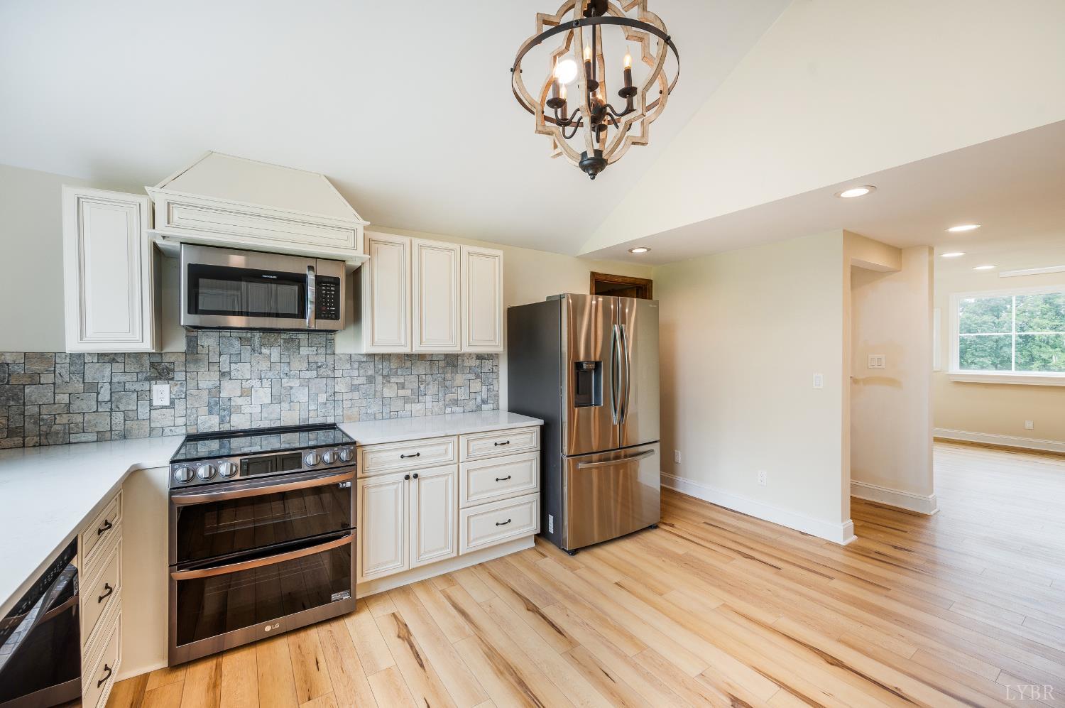 7845 Bear Creek Road Gladys, VA 24554 - Photo 80 of 99 a kitchen with stainless steel appliances a stove a microwave and cabinets