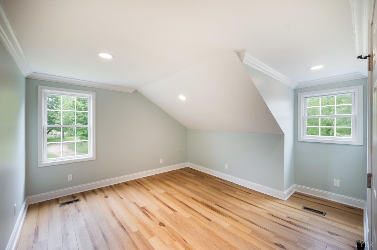 7845 Bear Creek Road Gladys, VA 24554 - Photo 82 of 99 an empty room with wooden floor and windows