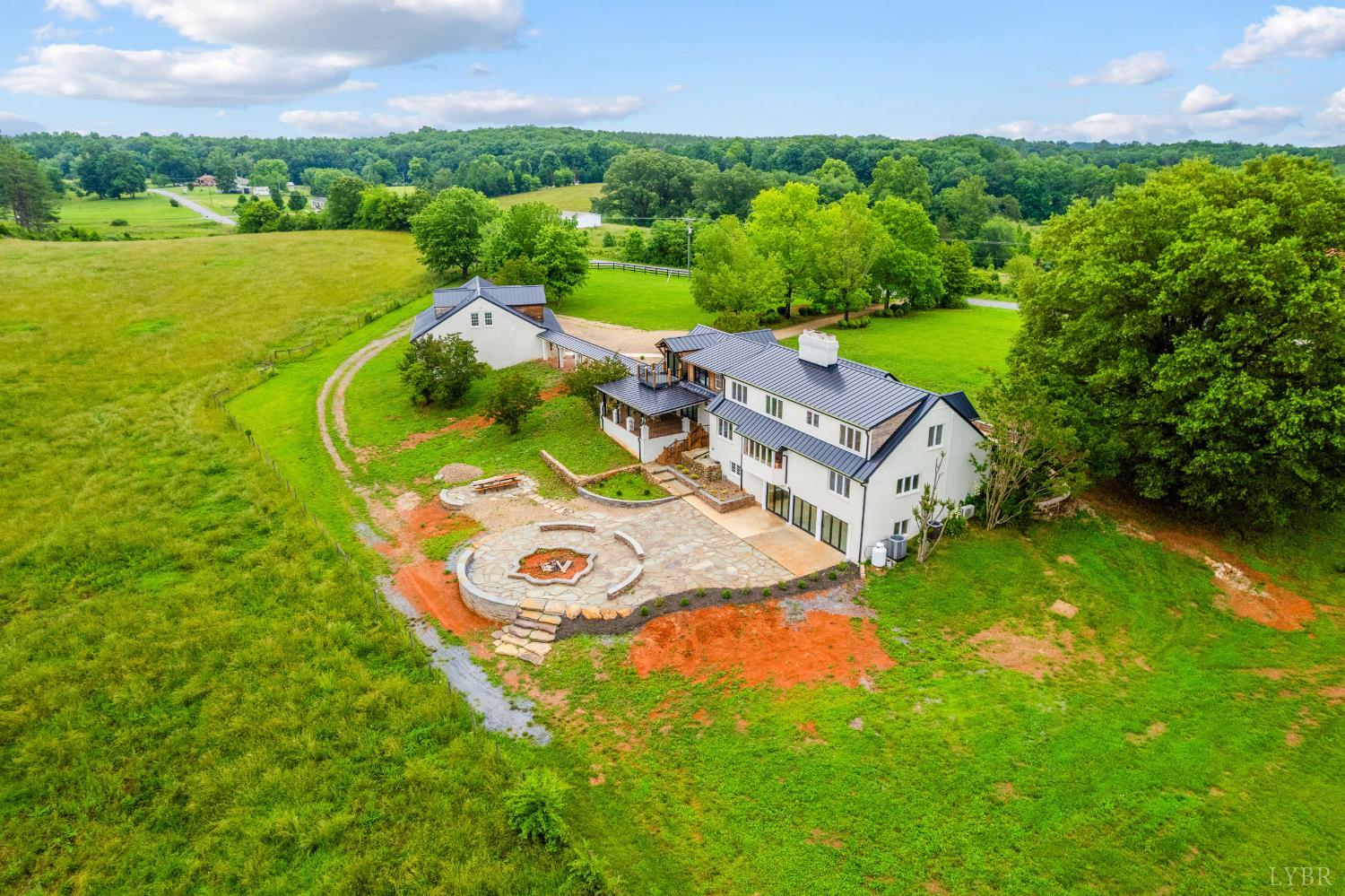 7845 Bear Creek Road Gladys, VA 24554 - Photo 9 of 99 an aerial view of a house with outdoor space swimming pool and mountains