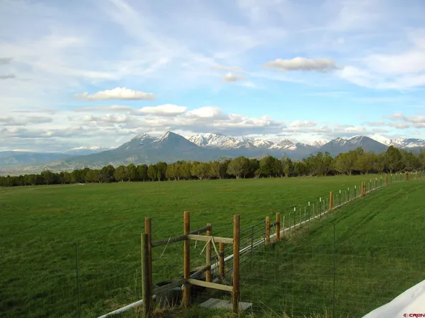 a view of an ocean and a mountain