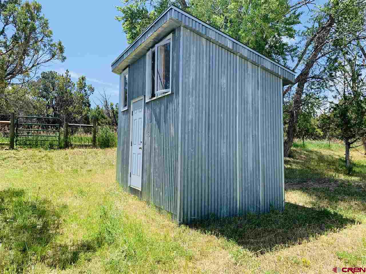 678 3375th Road Crawford, CO 81415 - Photo 20 of 42 a backyard of a house with lots of green space