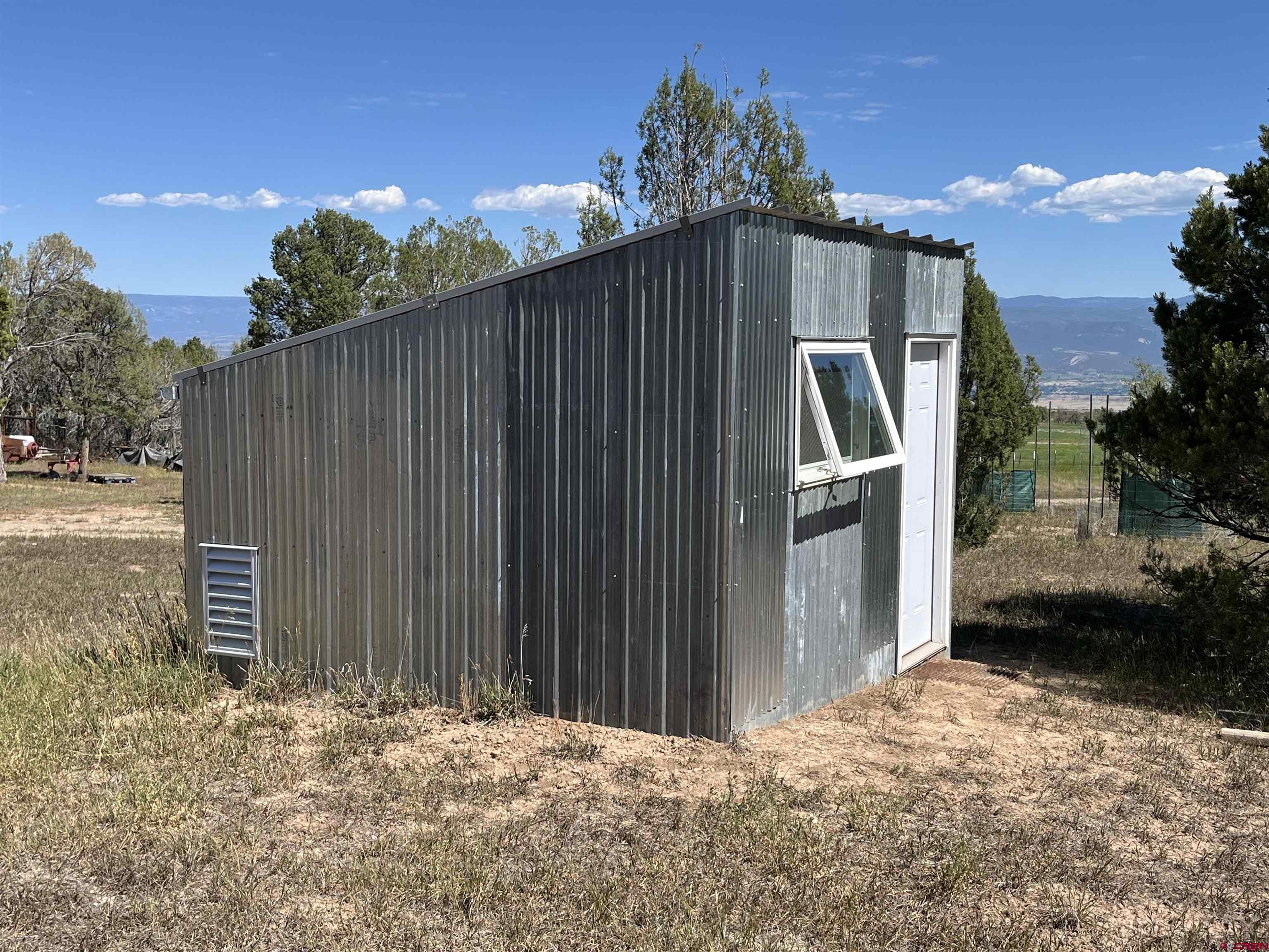678 3375th Road Crawford, CO 81415 - Photo 21 of 42 a backyard of a house