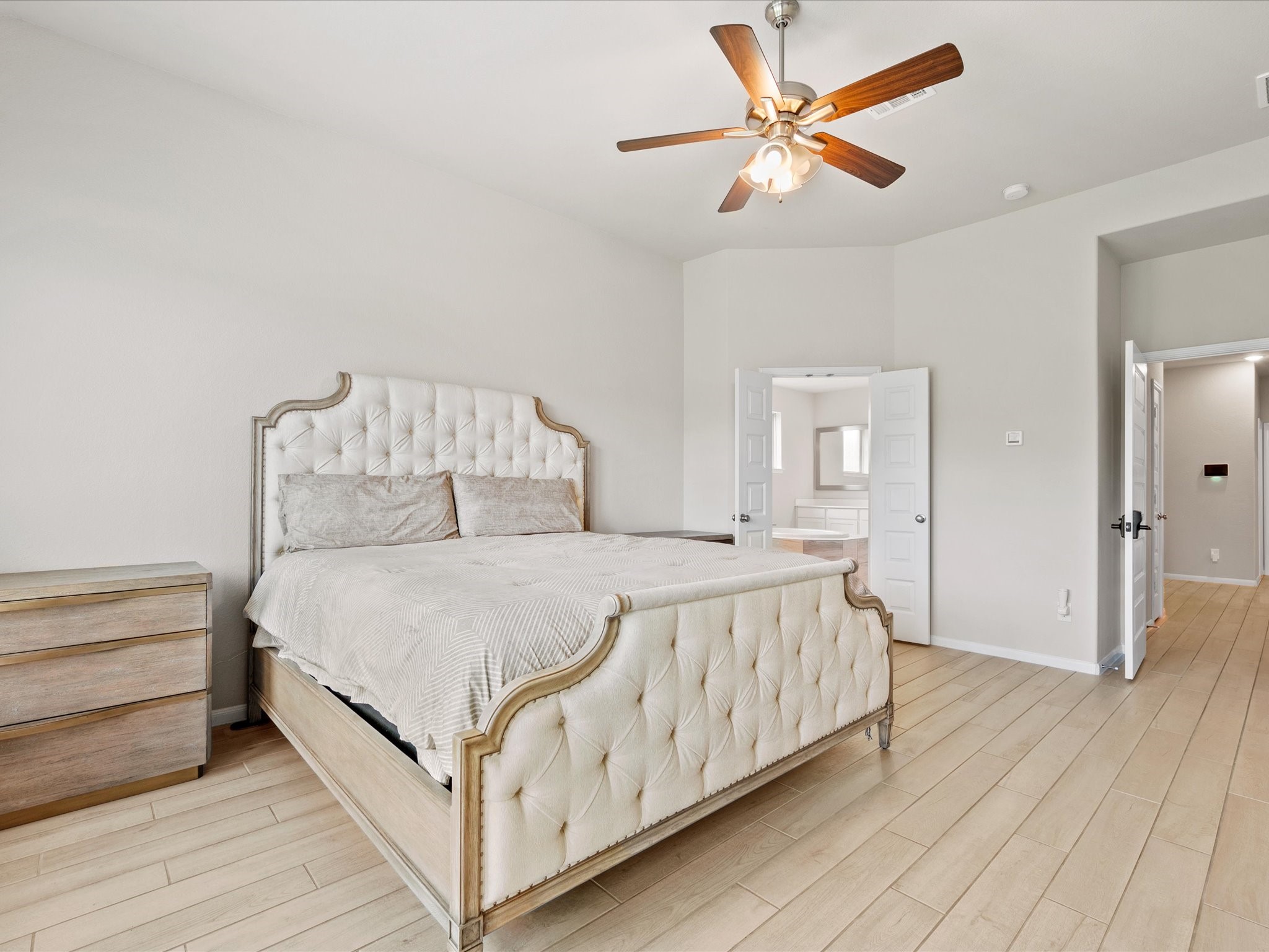 262 Peninsula Point Drive Montgomery, TX 77356 - Photo 14 of 45 a bed room with a bed and a chandelier