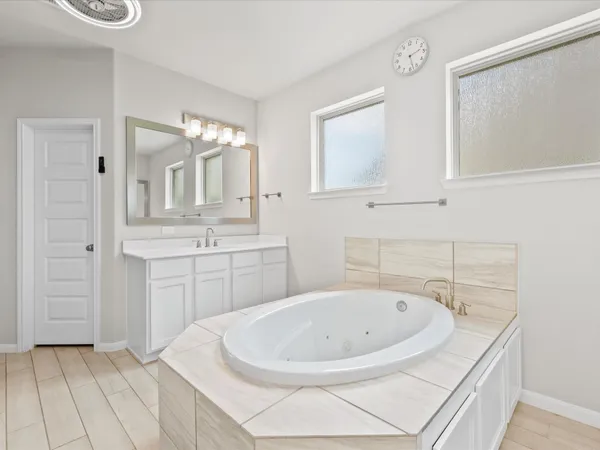 a view of a livingroom with workspace and a window