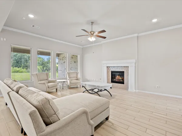 a living room with furniture and kitchen view