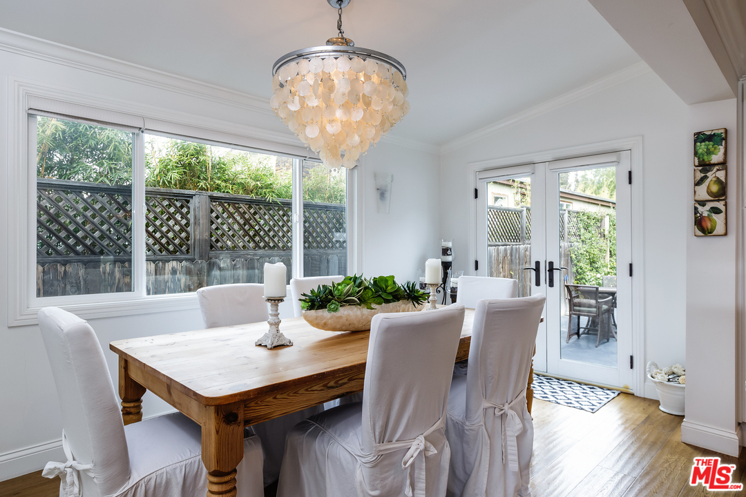 248 Paradise Cove Road Malibu, CA 90265 - Photo 11 of 35 a view of a dining room with furniture wooden floor and chandelier