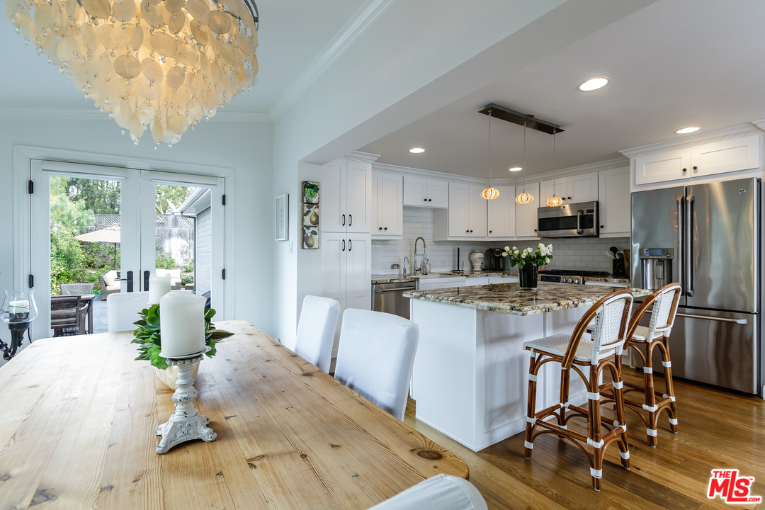 248 Paradise Cove Road Malibu, CA 90265 - Photo 12 of 35 a view of a dining room with furniture and wooden floor