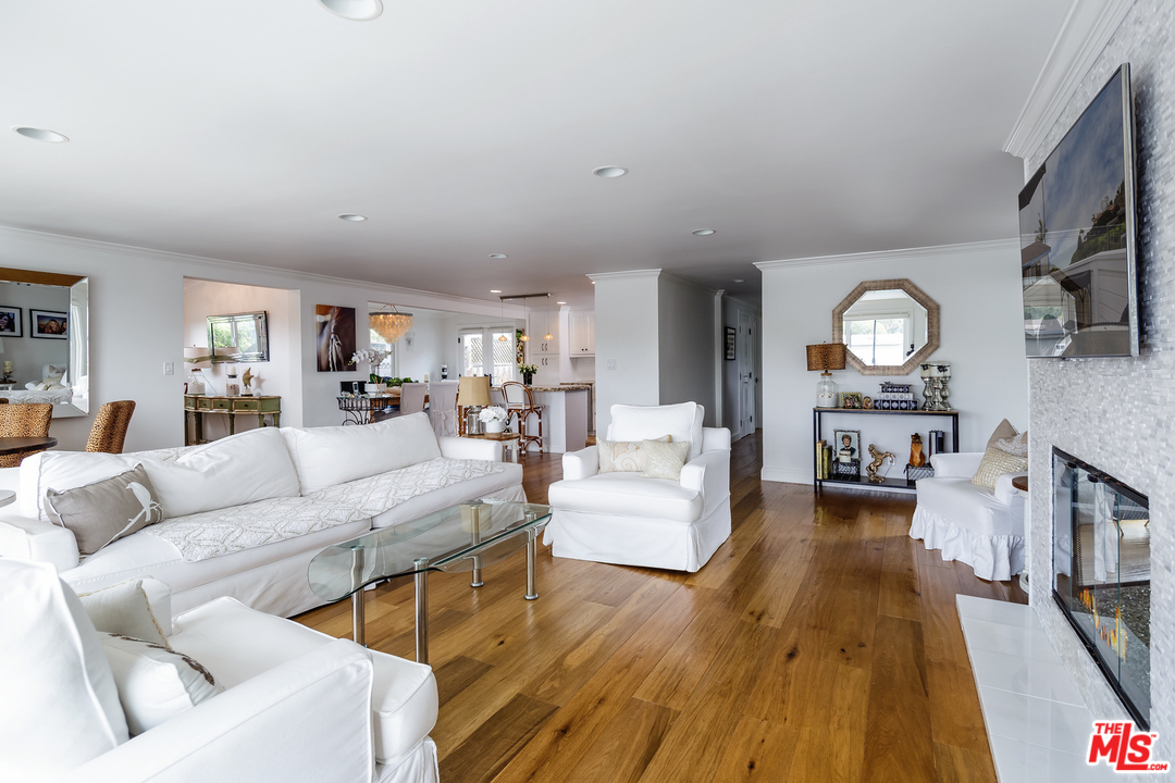 248 Paradise Cove Road Malibu, CA 90265 - Photo 15 of 35 a living room with furniture and a wooden floor