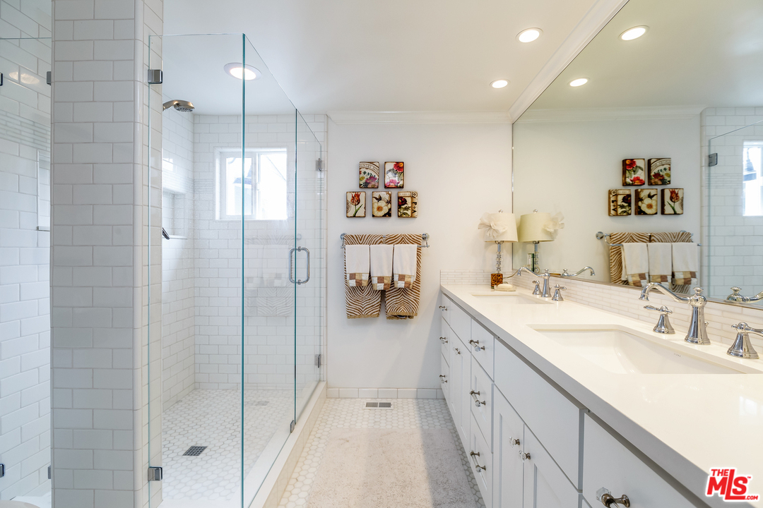 248 Paradise Cove Road Malibu, CA 90265 - Photo 18 of 35 a bathroom with a double vanity sink mirror and shower