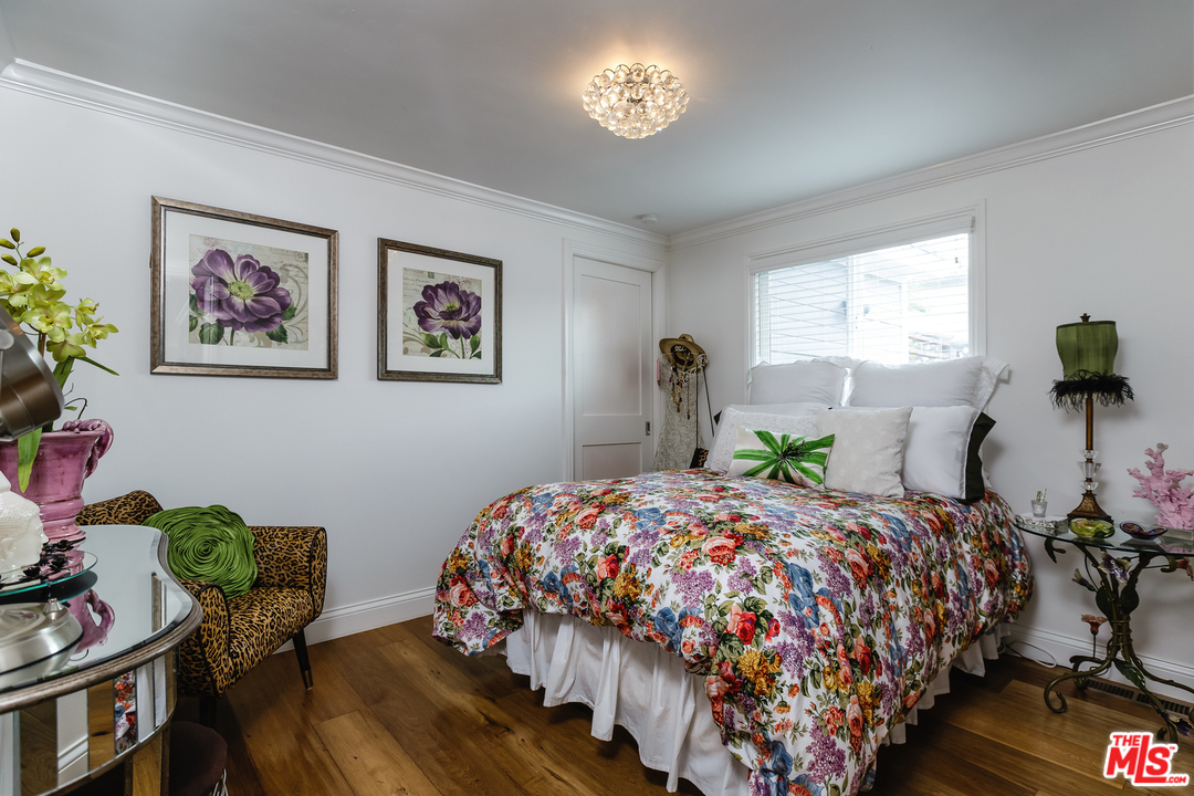 248 Paradise Cove Road Malibu, CA 90265 - Photo 20 of 35 a bedroom with bed and a chandelier