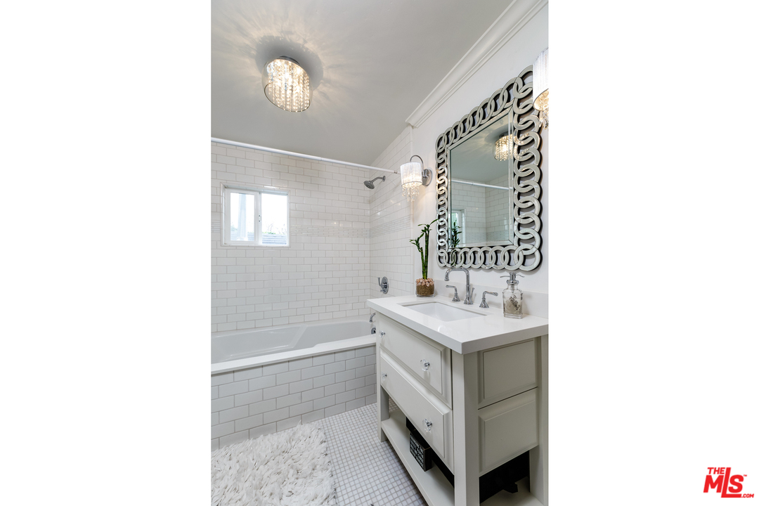 248 Paradise Cove Road Malibu, CA 90265 - Photo 21 of 35 a bathroom with a sink and a mirror