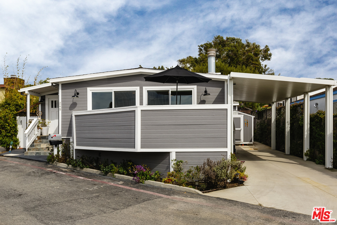 248 Paradise Cove Road Malibu, CA 90265 - Photo 31 of 35 a front view of a house with a yard