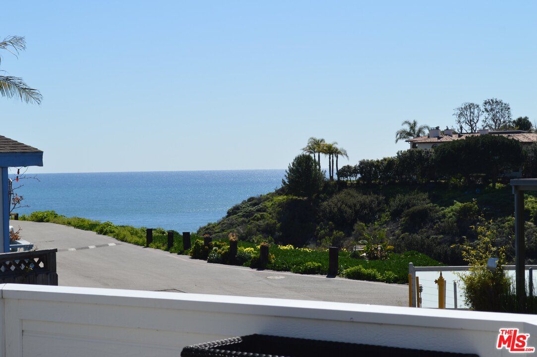 248 Paradise Cove Road Malibu, CA 90265 - Photo 7 of 35 an aerial view of a house with a yard and mountain view in back