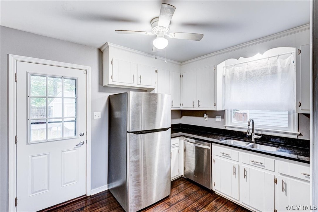3909 Echo Ridge Place Midlothian, VA 23112 - Photo 5 of 14 a kitchen with granite countertop a refrigerator a sink and white cabinets