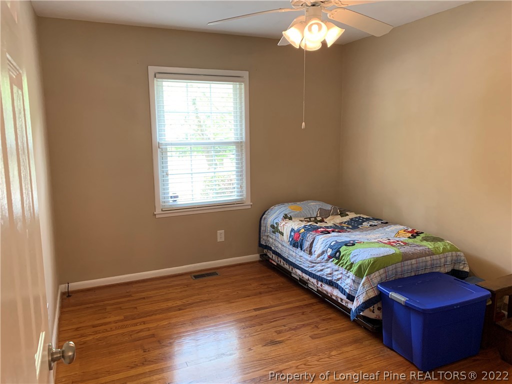 3629 Drayton Road Fayetteville, NC 28303 - Photo 17 of 31 a bedroom with a bed and a window