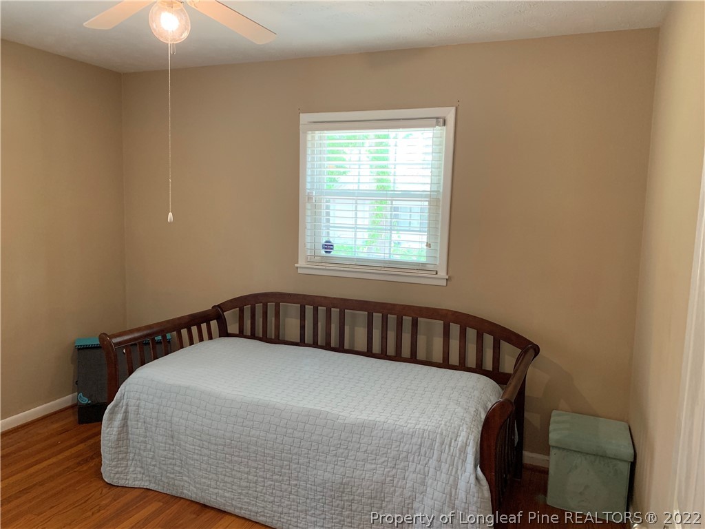 3629 Drayton Road Fayetteville, NC 28303 - Photo 18 of 31 a bedroom with a bed and window