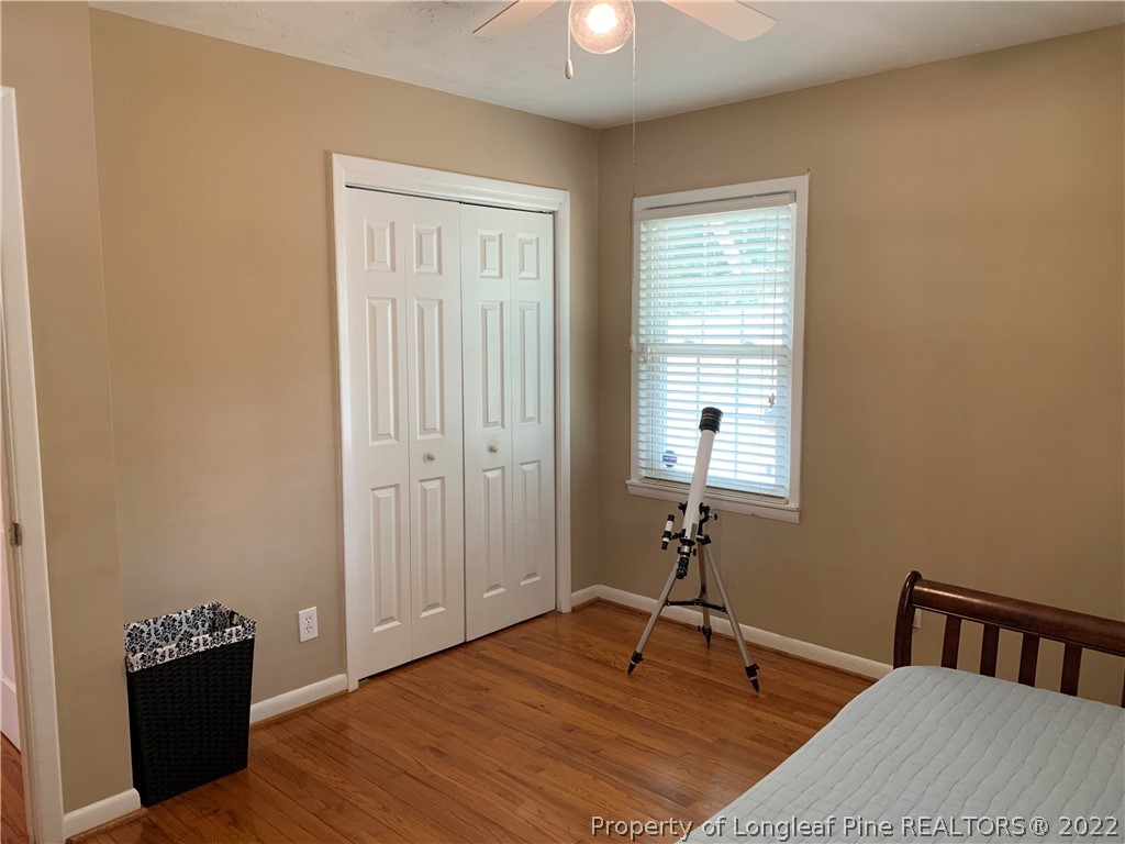 3629 Drayton Road Fayetteville, NC 28303 - Photo 19 of 31 a bedroom with a bed and a table