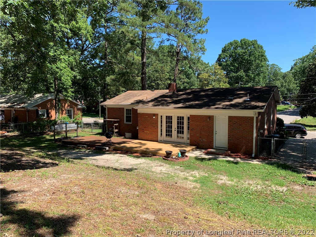 3629 Drayton Road Fayetteville, NC 28303 - Photo 26 of 31 a view of a house with backyard sitting area and garden