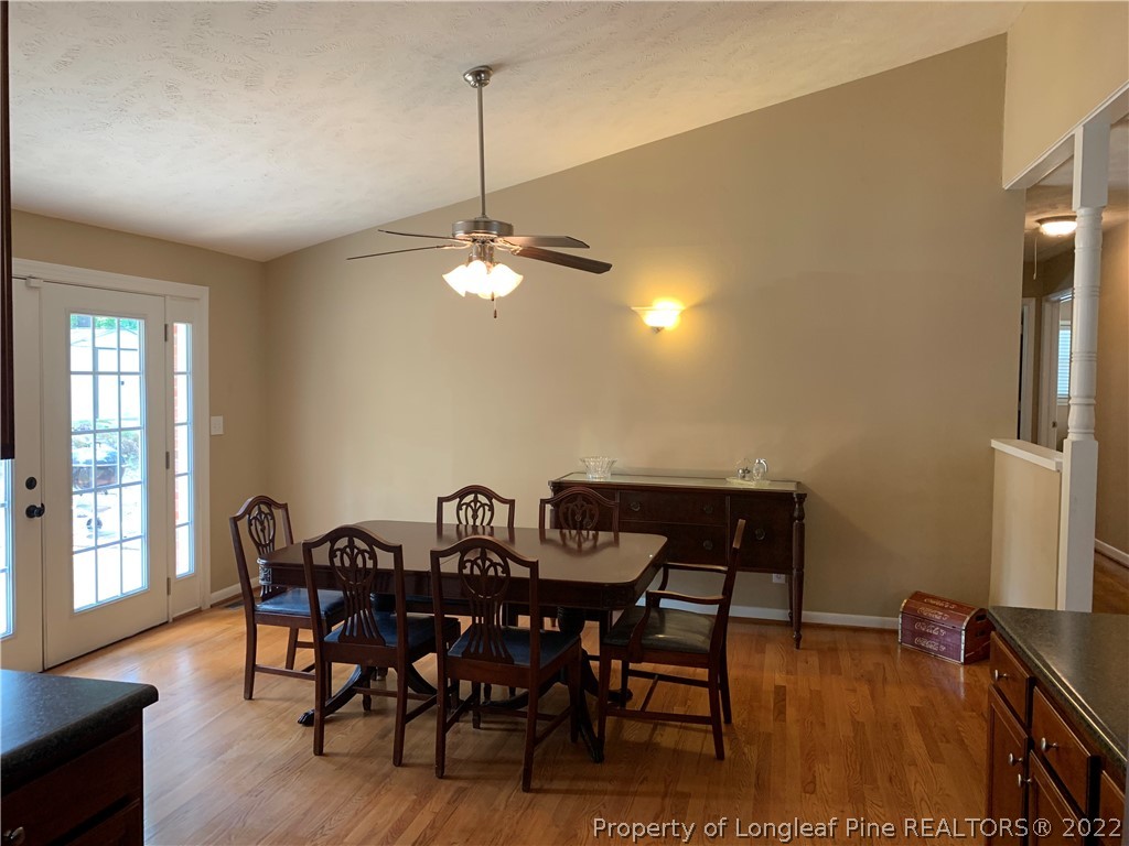3629 Drayton Road Fayetteville, NC 28303 - Photo 10 of 31 a view of a dining room with furniture and wooden floor