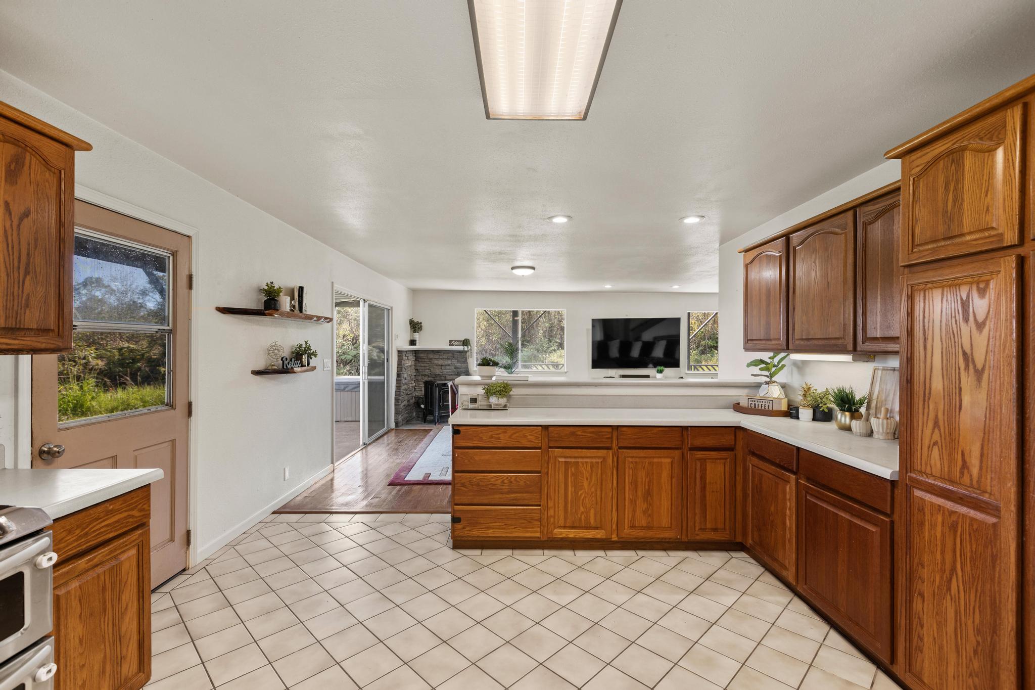 18-4565 Makaala Rd Mountain View Mountain View, HI 96771 - Photo 6 of 25 a large kitchen with stainless steel appliances lots of counter top space