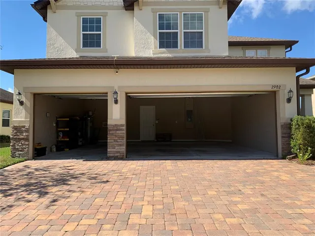 a view of staircase with white walls and a window