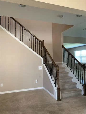a view of hallway with windows