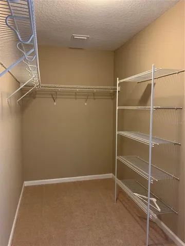a view of an empty walk in closet