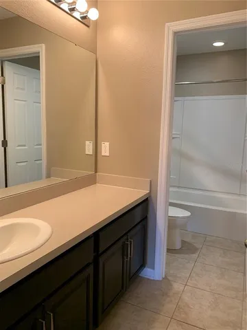 a bathroom with a toilet and a bathtub