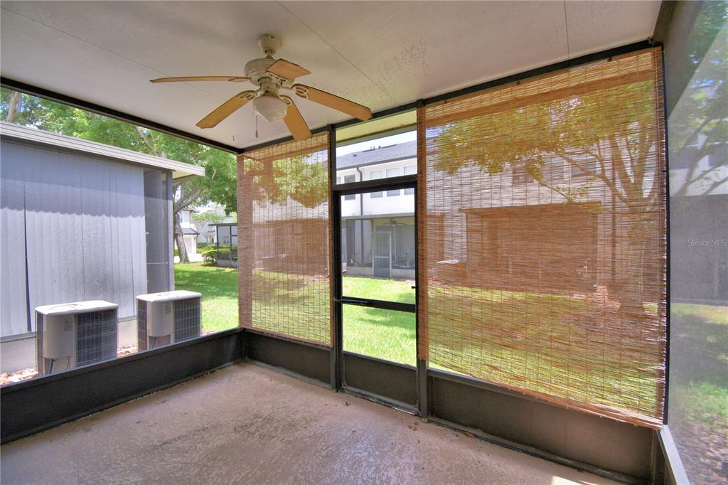3151 Sinclair Street, Unit 104 Orlando, FL 32835 - Photo 14 of 64 a room with furniture and a large window