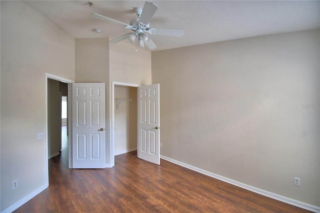 3151 Sinclair Street, Unit 104 Orlando, FL 32835 - Photo 35 of 64 a view of an empty room with wooden floor