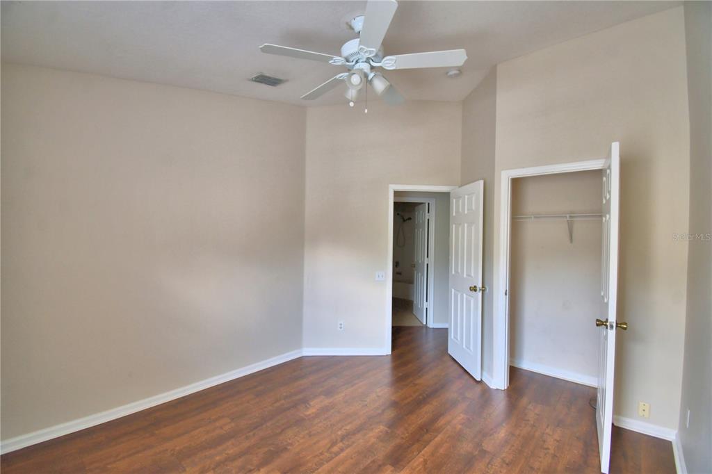 3151 Sinclair Street, Unit 104 Orlando, FL 32835 - Photo 36 of 64 a view of an empty room with wooden floor