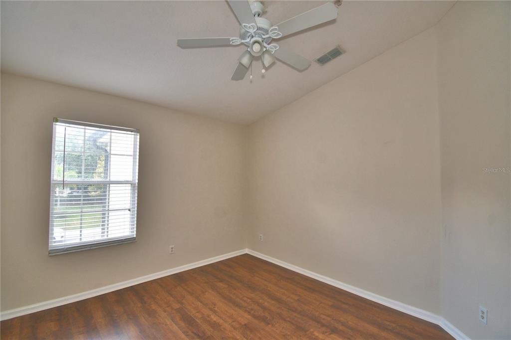 3151 Sinclair Street, Unit 104 Orlando, FL 32835 - Photo 37 of 64 an empty room with a window and a fan