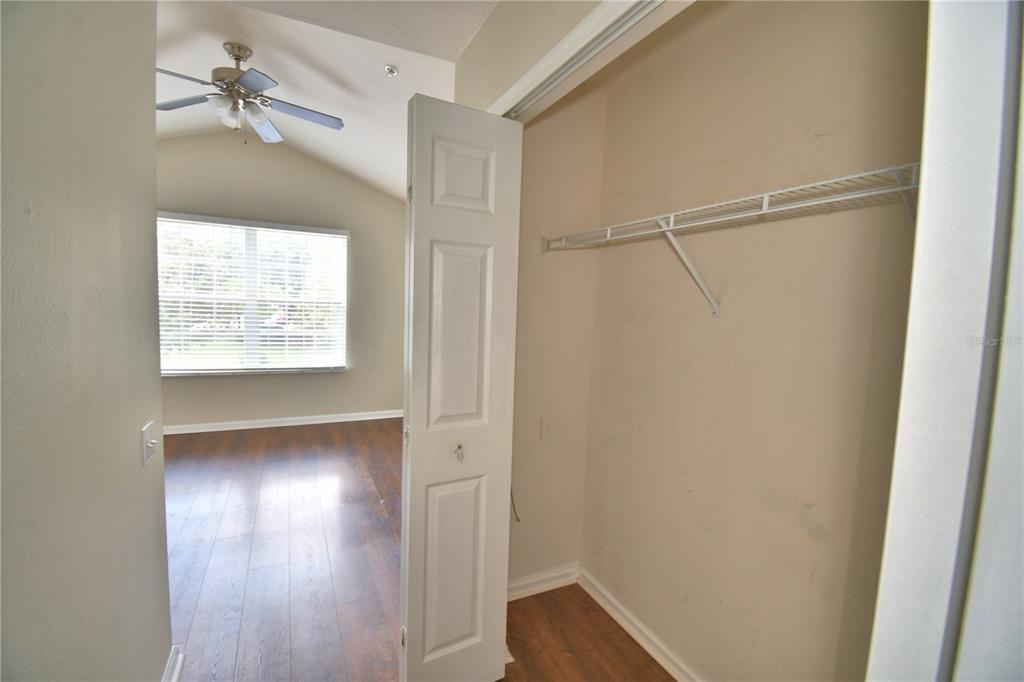 3151 Sinclair Street, Unit 104 Orlando, FL 32835 - Photo 41 of 64 a view of empty room with wooden floor and fan
