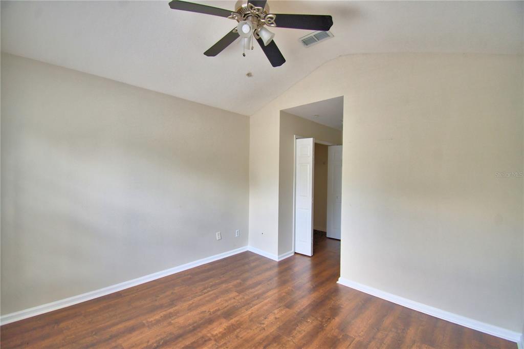 3151 Sinclair Street, Unit 104 Orlando, FL 32835 - Photo 44 of 64 wooden floor in an empty room