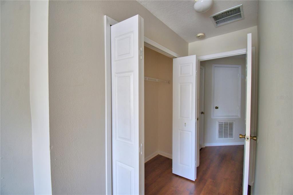 3151 Sinclair Street, Unit 104 Orlando, FL 32835 - Photo 46 of 64 a view of a hallway with wooden floor