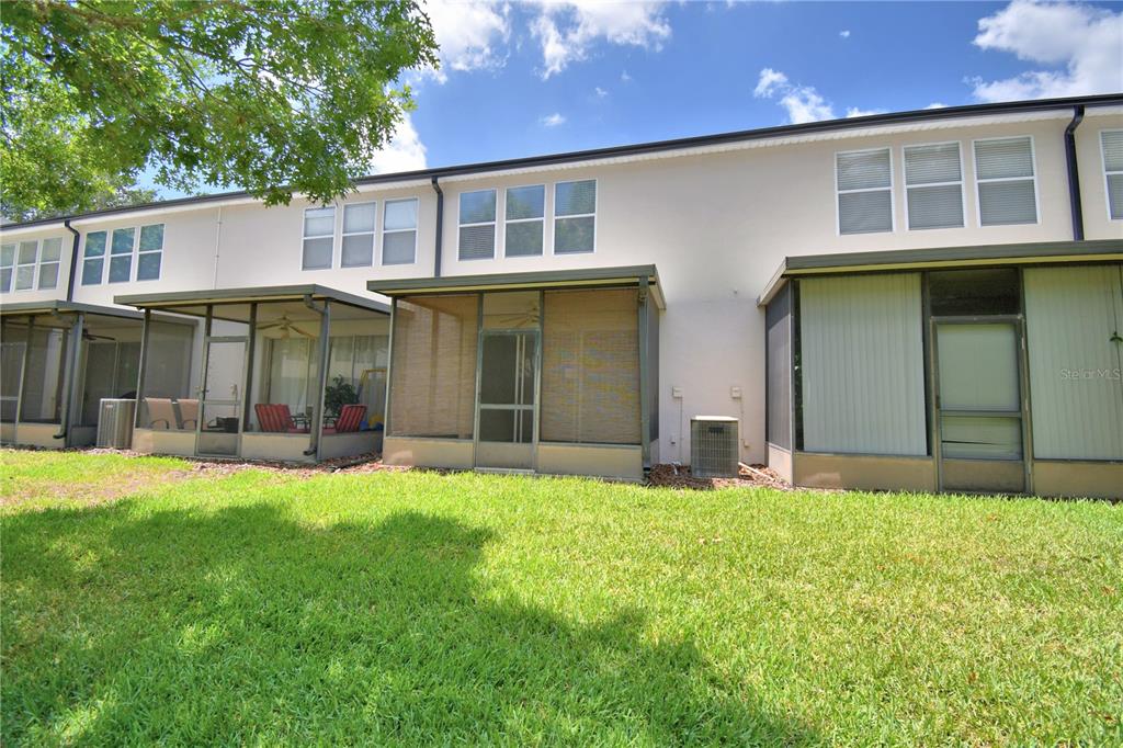 3151 Sinclair Street, Unit 104 Orlando, FL 32835 - Photo 50 of 64 front view of a house with a yard