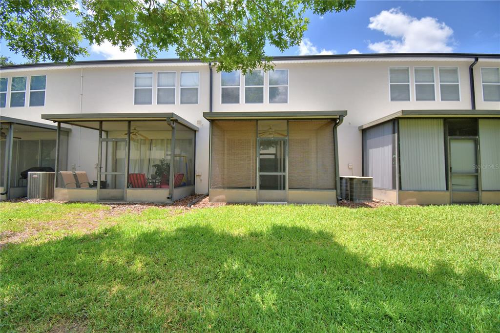 3151 Sinclair Street, Unit 104 Orlando, FL 32835 - Photo 51 of 64 front view of a house with a yard