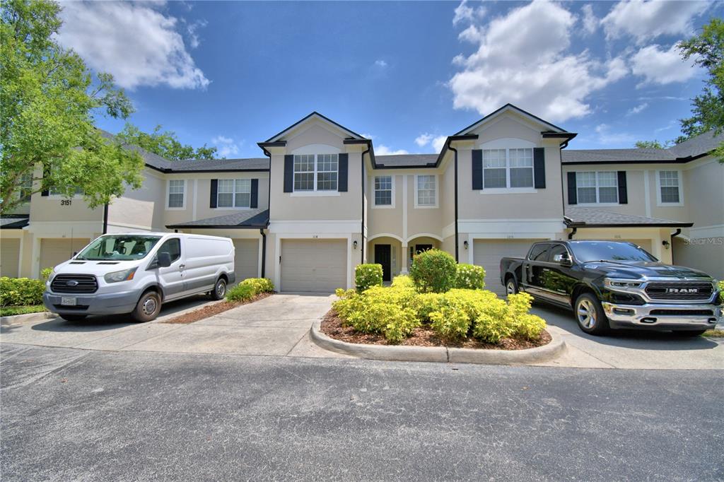 3151 Sinclair Street, Unit 104 Orlando, FL 32835 - Photo 53 of 64 a car parked in front of a house