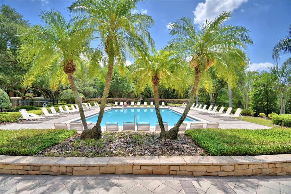 3151 Sinclair Street, Unit 104 Orlando, FL 32835 - Photo 60 of 64 a view of a park with palm trees