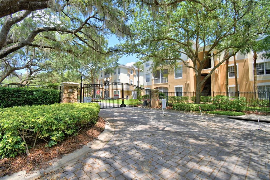 3151 Sinclair Street, Unit 104 Orlando, FL 32835 - Photo 64 of 64 a view of a large garden with plants and large trees