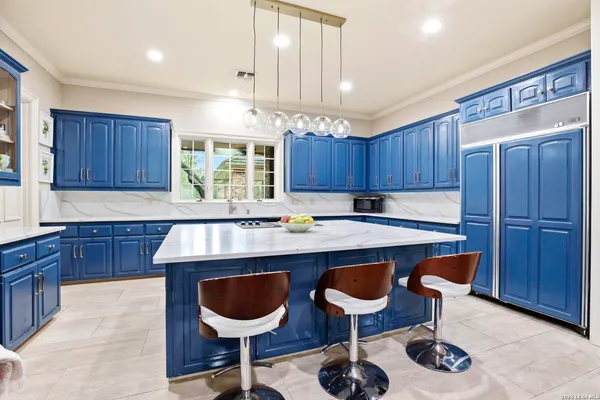 a kitchen with a dining table and chairs