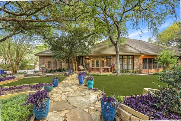 a front view of a house with garden