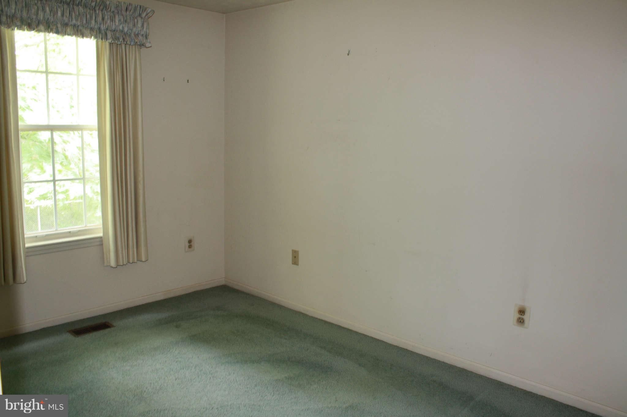 7106 Johnnycake Road Baltimore, MD 21228 - Photo 22 of 30 an empty room with a window
