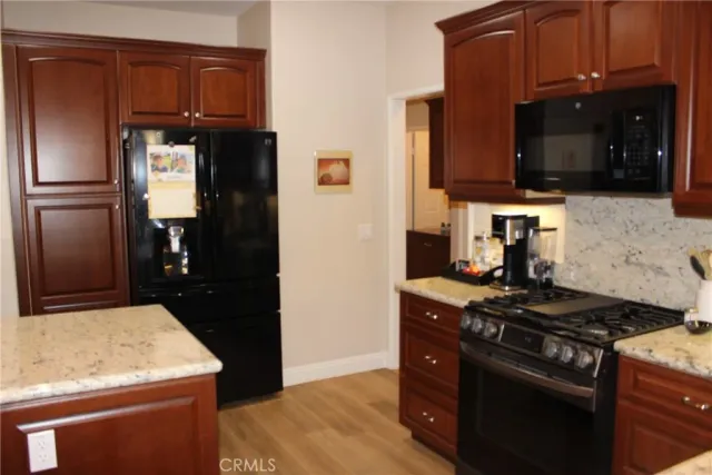 a kitchen with a stove and a microwave