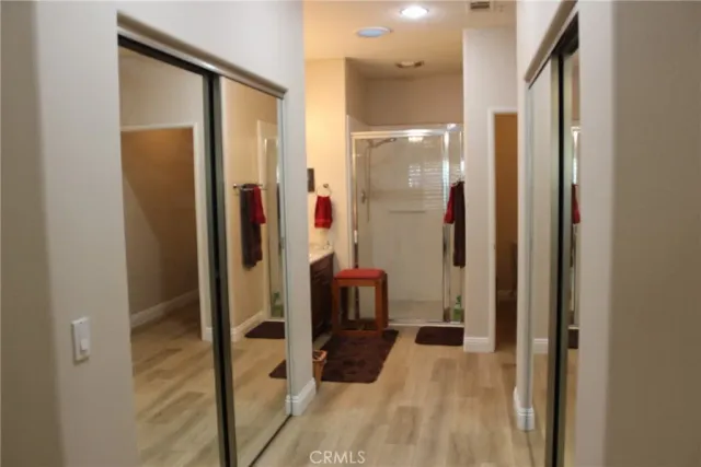 a bathroom with a mirror and a shower